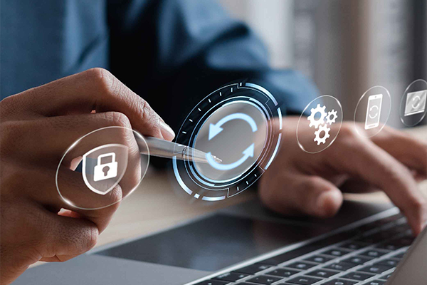 Hands using laptop with holographic refresh, security lock, gears and device maintenance icons